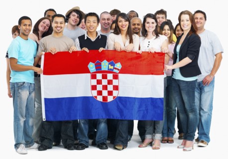 Group of people holding flag. Photographe : momentimages