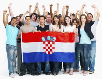 Group of people holding flag. Photographe : momentimages