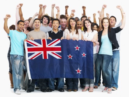 Group of people holding Australian flag. Photographe : momentimages