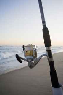 Fishing pole on the beach. Photographe : Chris Hackett