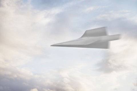 Paper airplane flying through the air. Photographe : Mike Kemp
