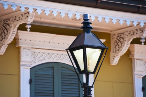 Lamp post in front of house in French Quarter of New Orleans.