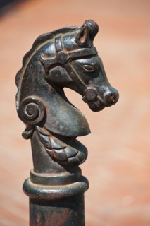 Iron statue of a horse's head.