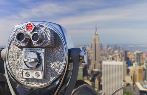 Coin operated binoculars looking out on New York City skyline.