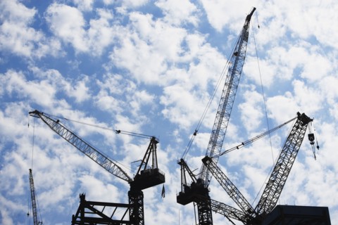 Cranes at construction site. Photo : fotog
