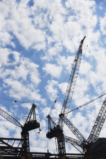 Cranes at construction site. Photo : fotog