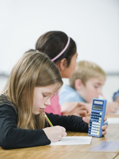 Students doing math work in classroom.
