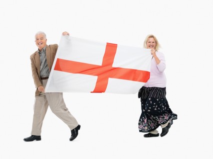 Two people carrying the flag of England. Photo : momentimages
