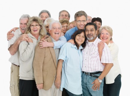 A group of people embracing. Photo : momentimages