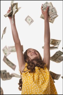 Young girl throwing money in the air. Photo : Mike Kemp
