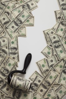 Lint roller picking up money. Photo : Mike Kemp