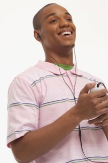Laughing man wearing earphones. Photo : K.Hatt
