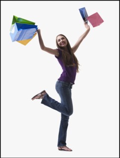 Teenage girl holding shopping bags. Photo : Mike Kemp