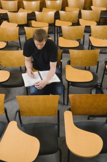 Last student left in college lecture hall.