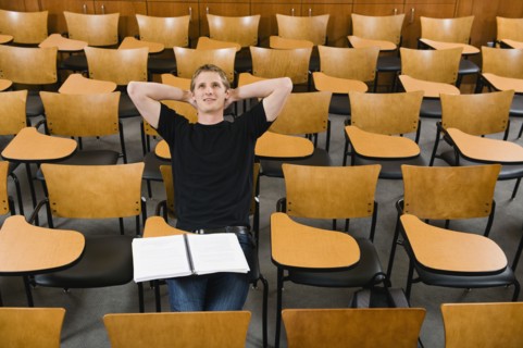 Last student left in college lecture hall.