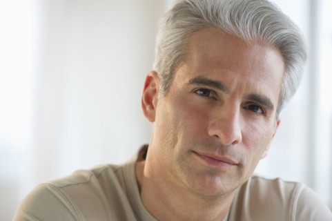 Portrait of a grey haired man.