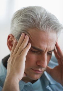 Man with a headache.