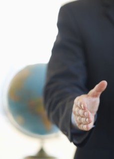 Hand extended for handshake.