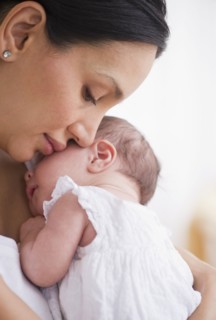 Mother holding her baby.