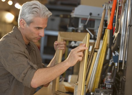 Craftsman making a picture frame.