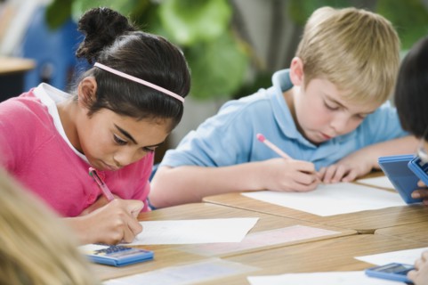 Students doing math work in classroom.