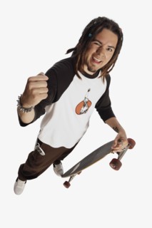 Teenage boy holding skateboard. Photo : Stewart Cohen
