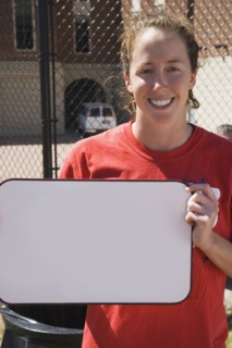 Teenage girl holding blank whiteboard. Photo : Stewart Cohen