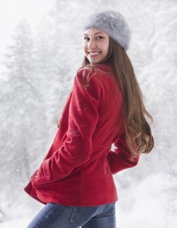 Happy woman outside on a snowy day. Photo : Mike Kemp
