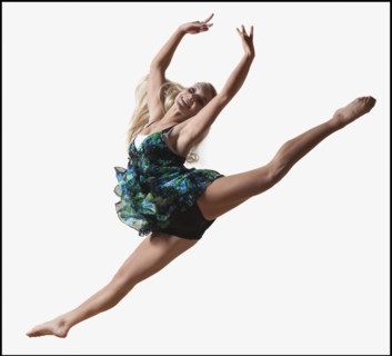 Female dancer jumping gracefully in the air. Photo : Mike Kemp