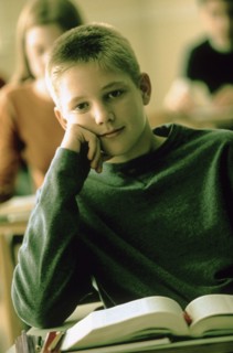 Elementary school student sitting at his desk. Photo : Rob Lewine