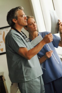 Doctor and nurse looking at chart. Photo : Rob Lewine
