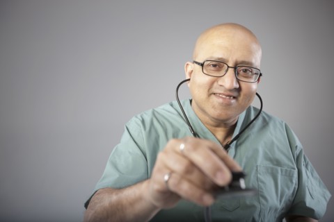 Doctor holding his stethoscope. Photo : Dan Bannister