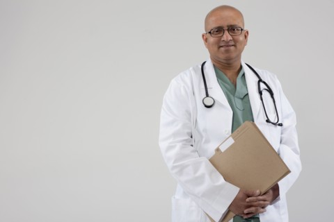 Doctor holding files. Photo : Dan Bannister