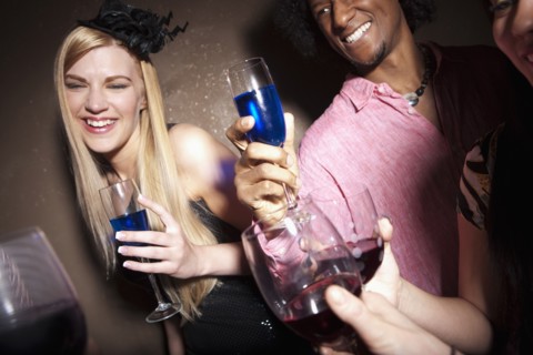 Group of people socializing at a party. Photo : Dan Bannister
