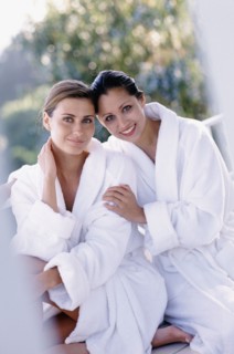 Two woman wearing bath robes. Photo : Rob Lewine