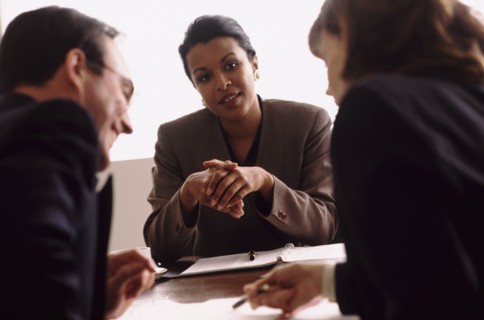 Financial advisor talking to couple. Photo : Rob Lewine