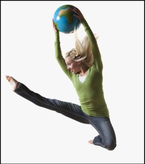 Woman jumping in air while holding globe. Photo : Mike Kemp