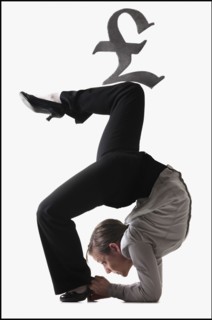 Pound symbol on top of contorted businesswoman. Photo : Mike Kemp