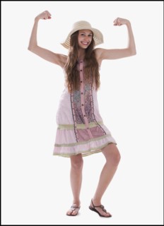 Beautiful long haired woman flexing her muscles. Photo : Mike Kemp