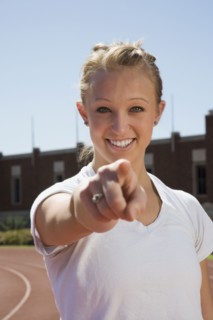Teenage girl pointing her finger. Photo : Stewart Cohen