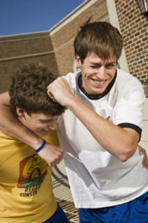 Boys play fighting. Photo : Stewart Cohen