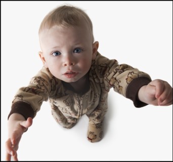 Baby reaching up. Photo : Mike Kemp
