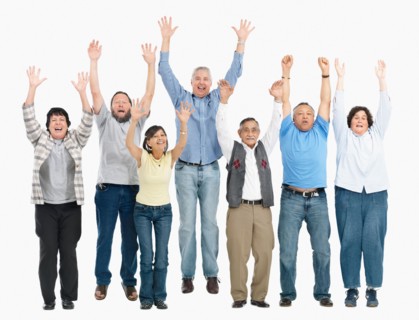 A group of people jumping with their arms raised. Photo : momentimages