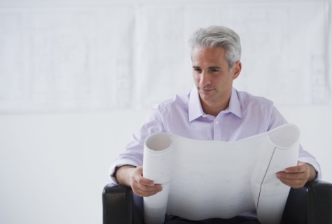 Architect looking at house plans.