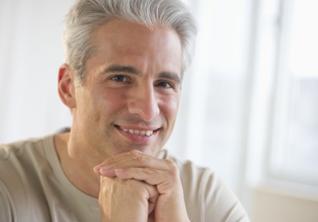 Portrait of a grey haired man.