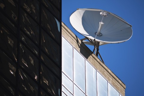 Satellite dish on top of building.