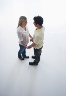 Happy couple holding hands.