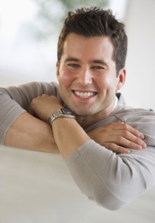 Handsome man relaxing on couch.