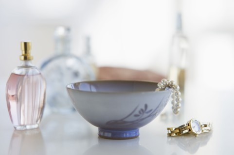 Woman's items on dresser.