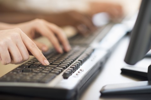 Employees working at computers.